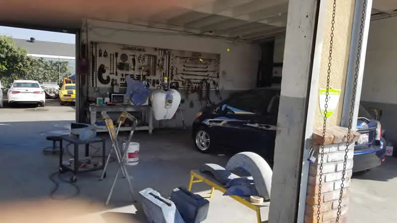Open work bay with tool wall at Cal Auto Restoration and Collision