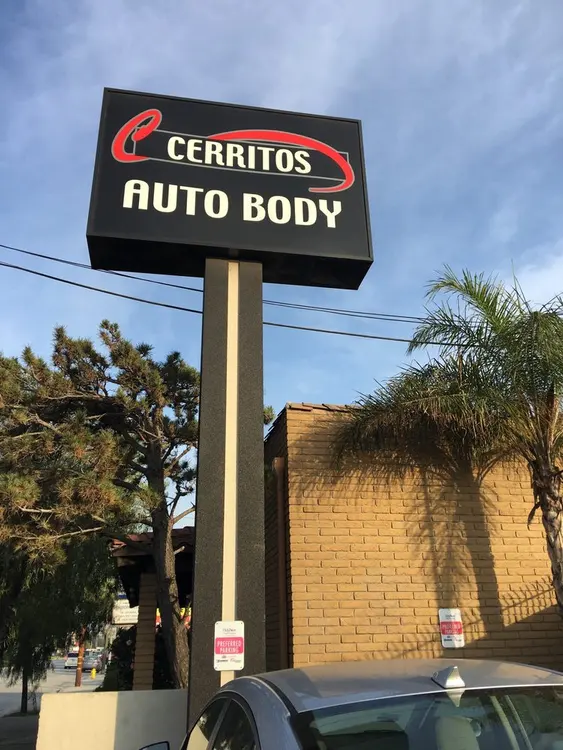 Cerritos Auto Body pole sign on Artesia Blvd