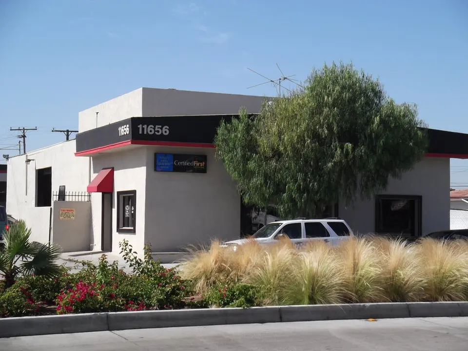 Street view of the Cerritos Auto Body building at 11656 Artesia Blvd