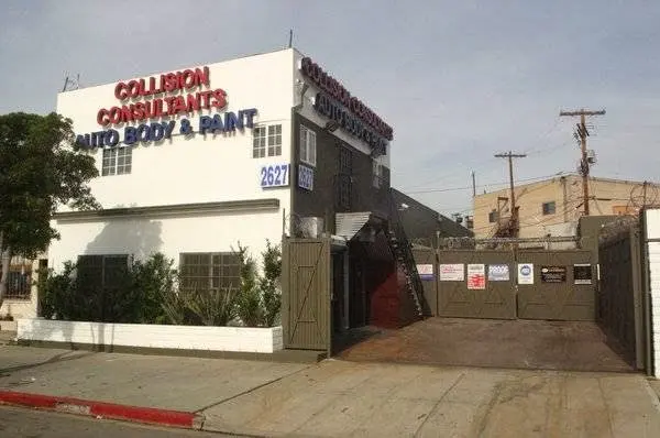 Street view of the Collision Consultants shop and gated lot