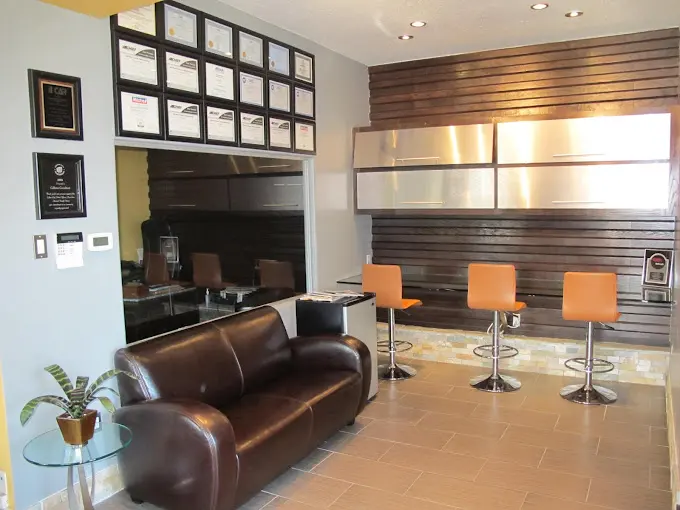 Customer lounge with certificates wall at Collision Consultants