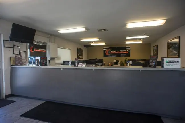 Inside Crash Champions Covina collision repair shop