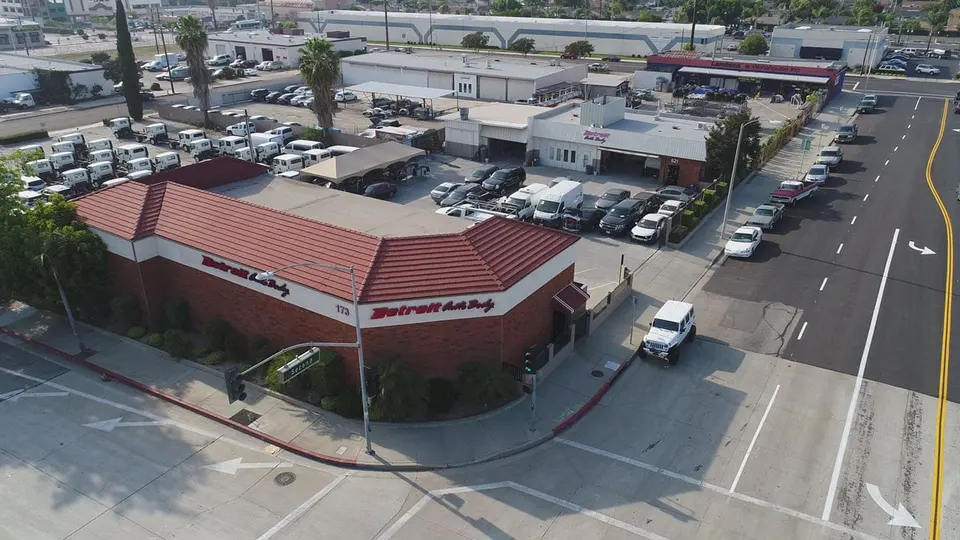 Aerial view of the Detroit Auto Body shop buildings in Covina