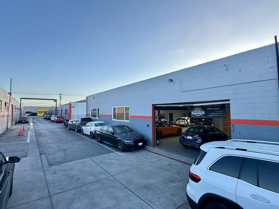 Exterior of Easy Fix Auto Body with open bay door in Gardena