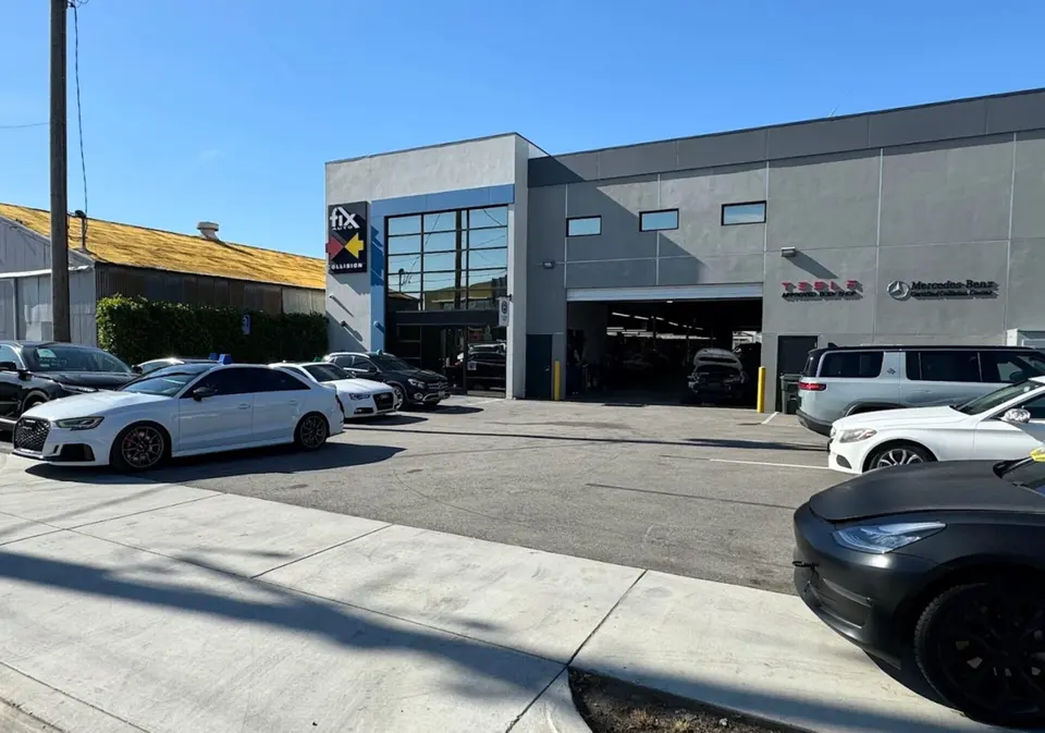 Fix Auto Temple City building with open service bay and Tesla and Mercedes-Benz certification signage