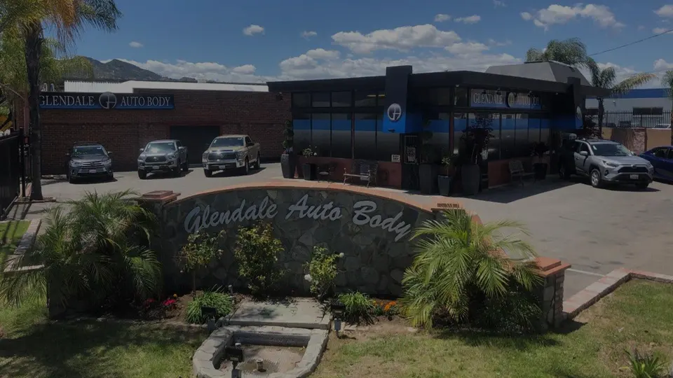 Glendale Auto Body building and landscaped sign on W Chevy Chase Dr