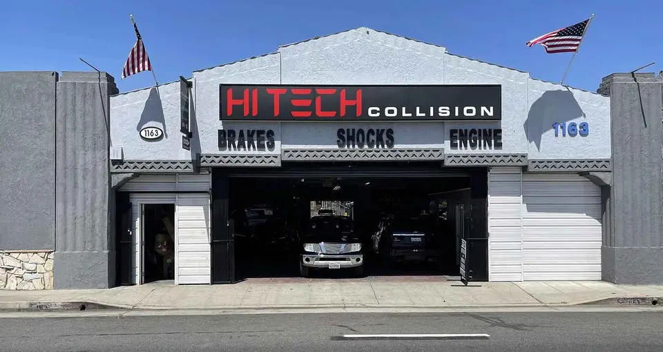 Street front of Hi Tech Collision at 1163 E Pacific Coast Hwy with open service bay