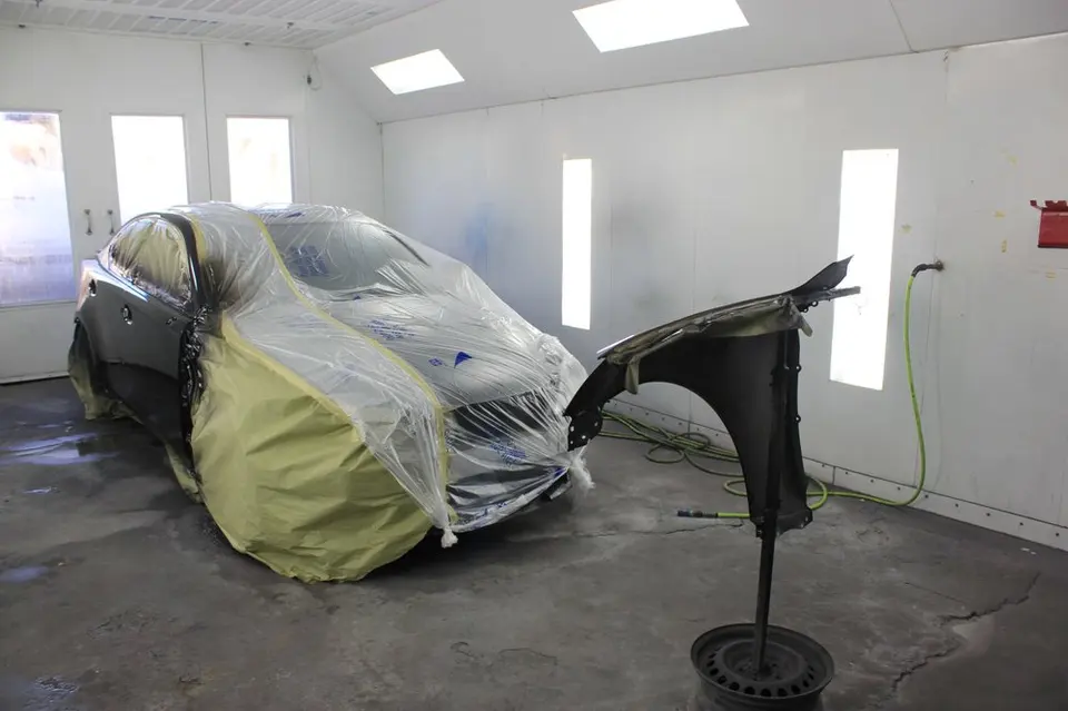 Masked vehicle in the paint booth at LA Collision Center in Covina