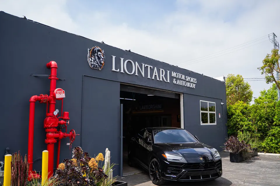 Liontari Motorsports & Auto Body shop entrance and bay door