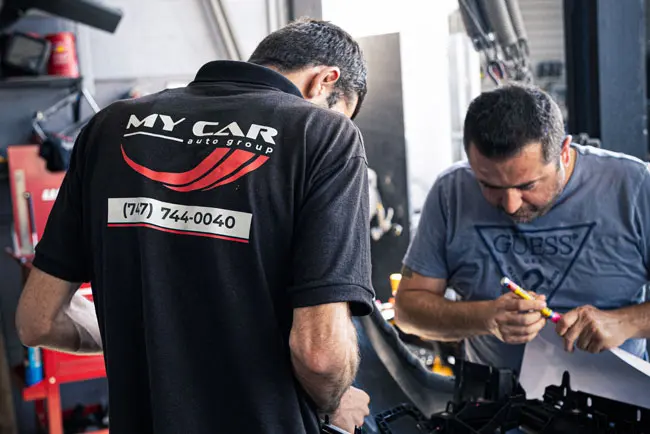 My Car Collision Center staff reviewing a repair in the Glendale shop