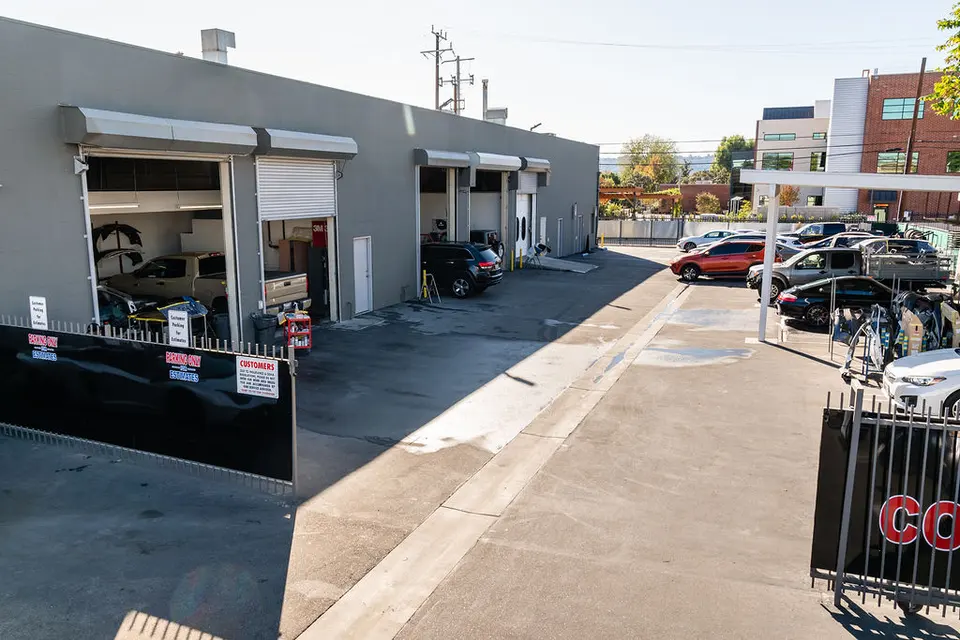 Repair bays and lot at Premium Collision Center