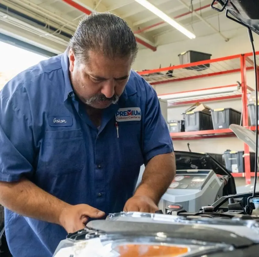 Premium Collision Center technician at work in the shop