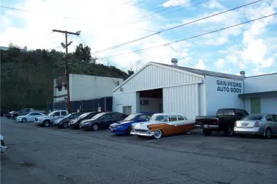 Cars parked outside San Pedro Auto Body shop
