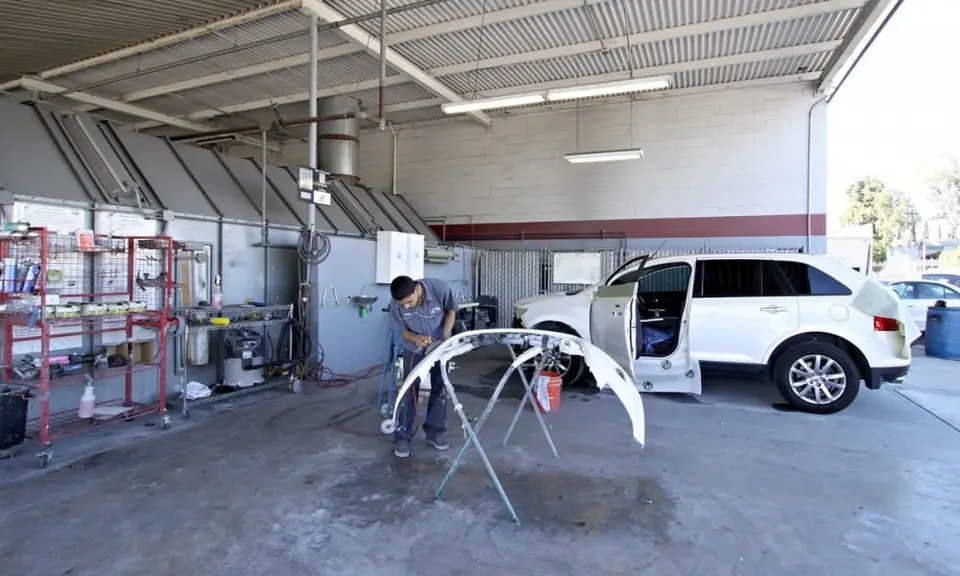 Technician preparing a bumper at Seidner's Rosemead
