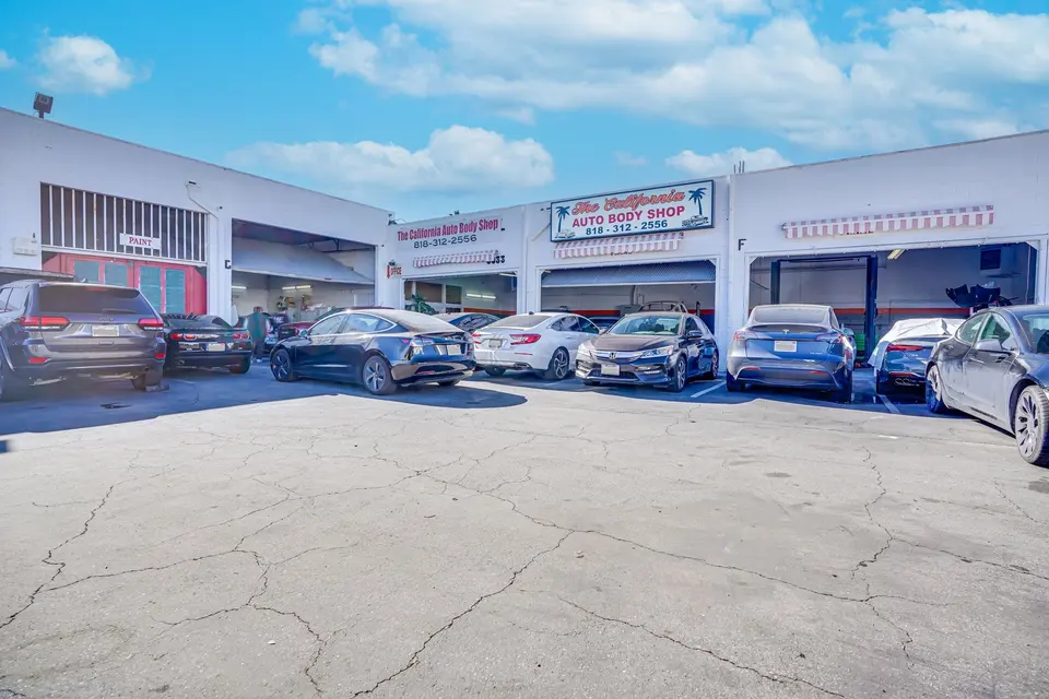 The California Auto Body Shop storefront and lot on Reseda Blvd