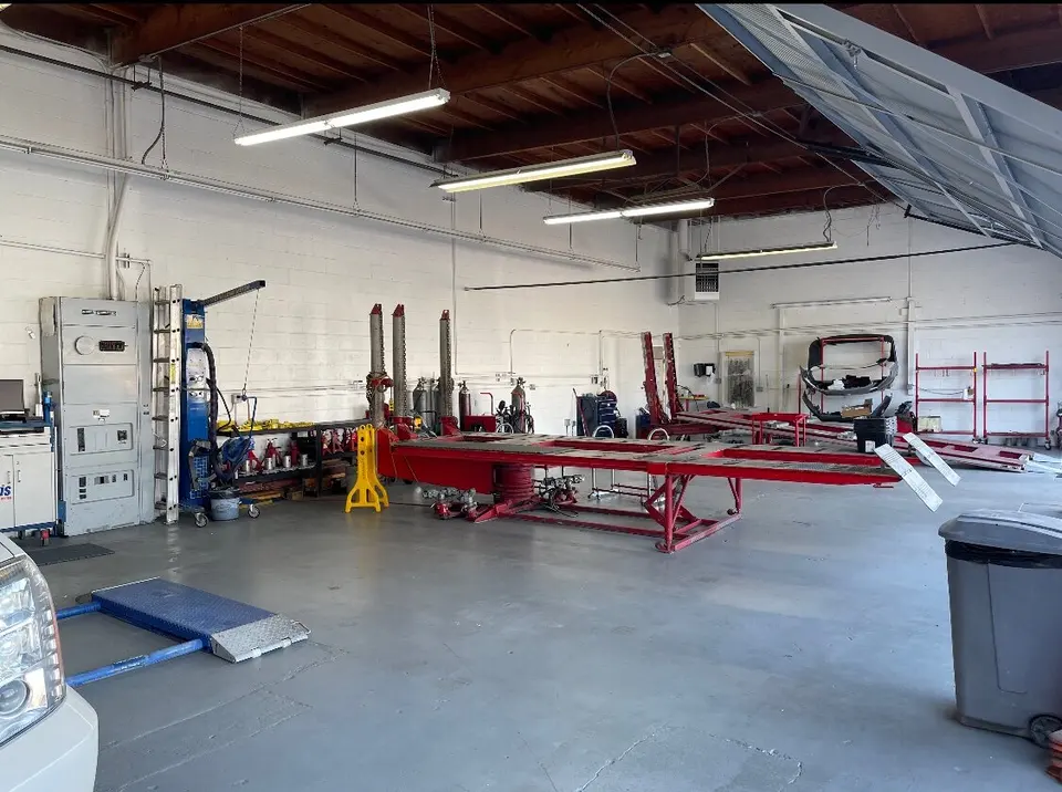 Repair floor with frame benches at The California Auto Body Shop